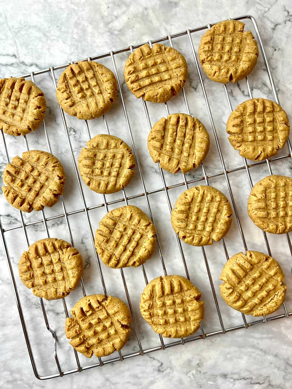 Vegan peanut butter cookies on a cooling rack.