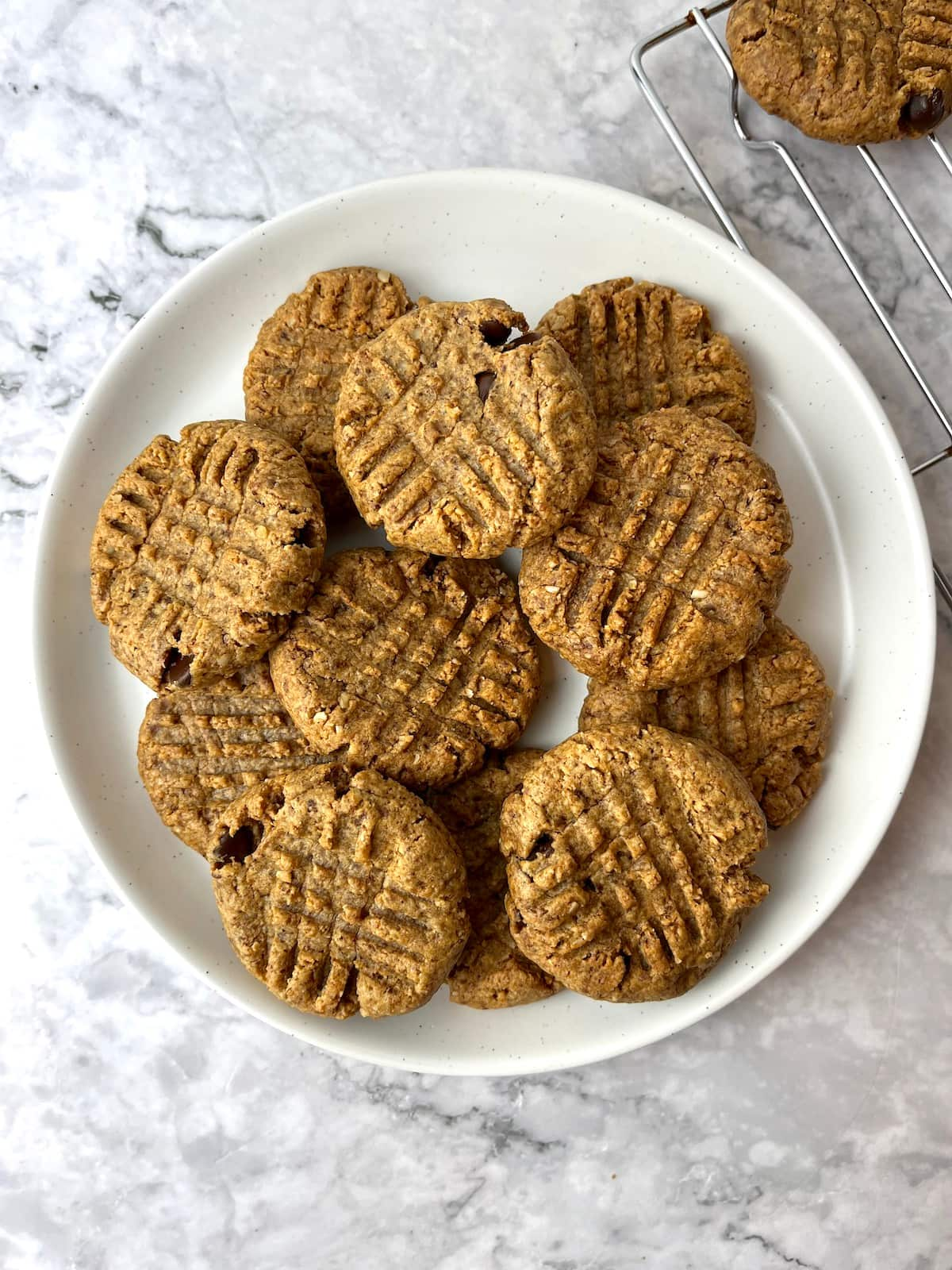 A plate of vegan almond butter chocolate chip cookies.