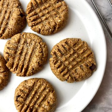 A plate of vegan almond butter cookies.