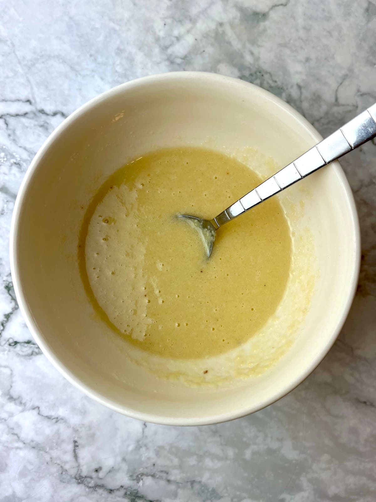 A bowl of vegan vanilla mug cake batter.